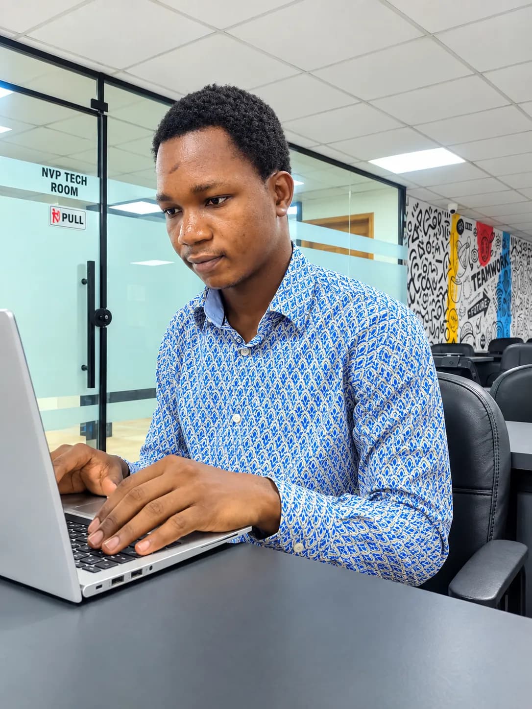 Yekeen Maadan working at the NVP Tech Room during the Learn2Earn AI Engineering Fellowship